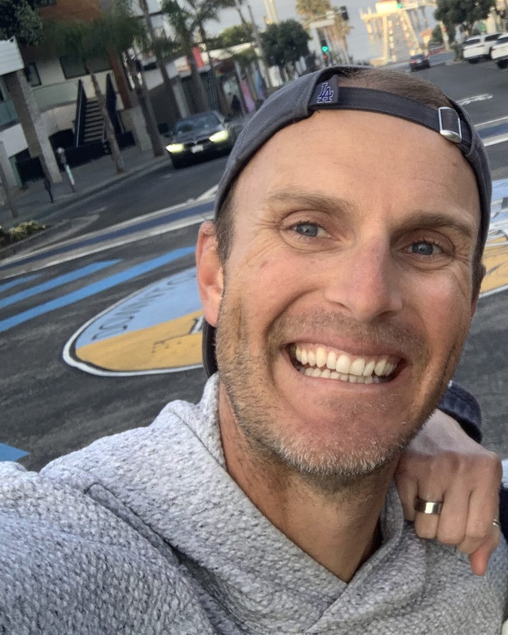 Jay Dixon smiling on a sunny morning near the beach